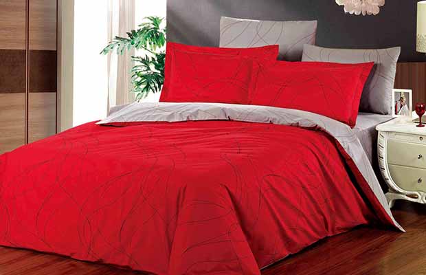 bed with red linens